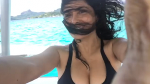 salma hayek on boat in black bikini showing off her sexy bust